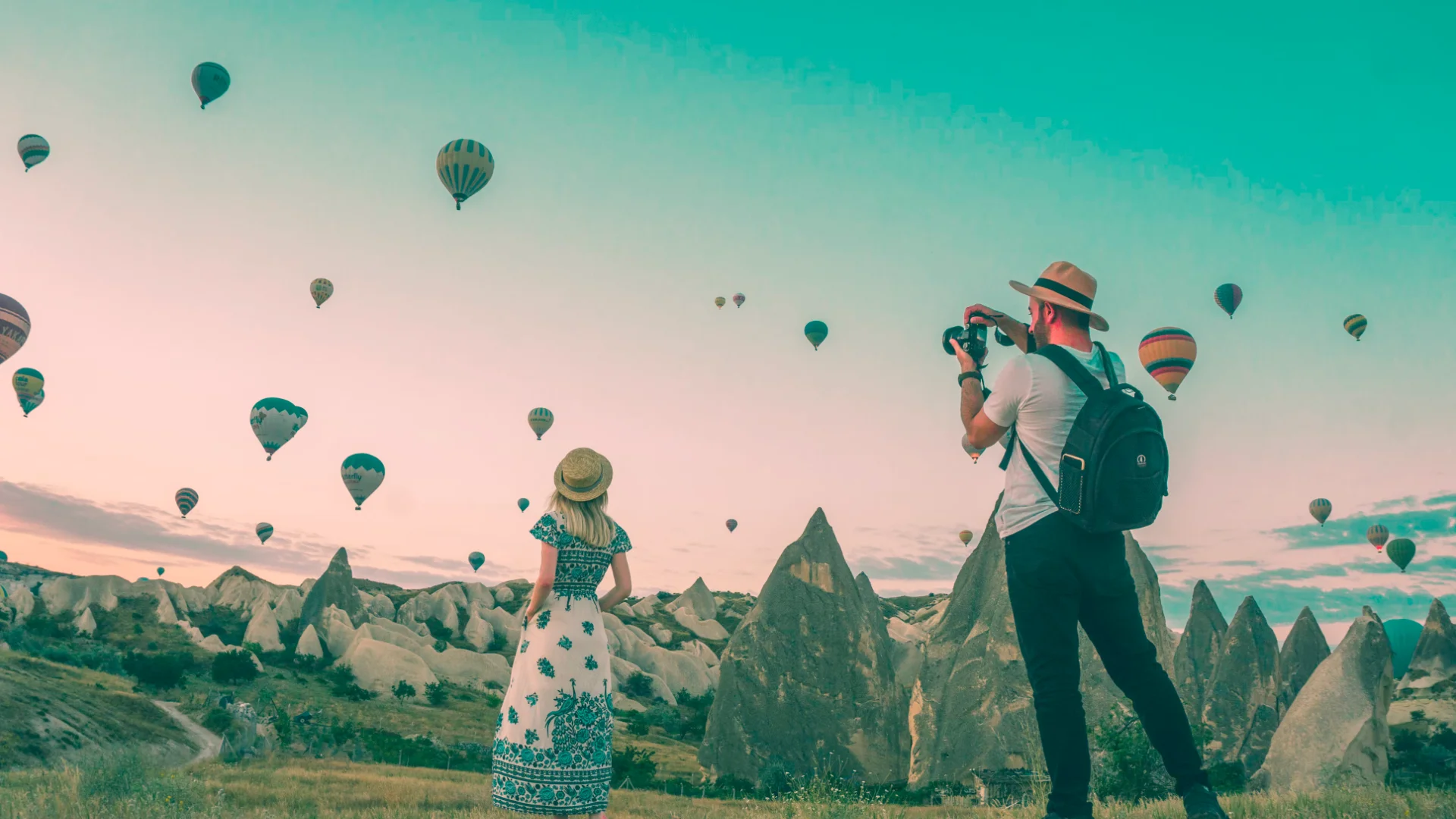 Travelers overlooking a scenic landscape
